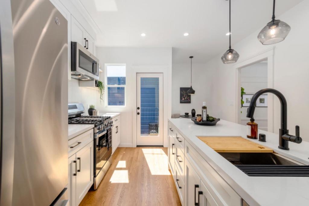 Modernized SF Classic with Bay Views in Silver Terrace! Welcome to this beautiful move-in-ready SF classic, nestled in the desirable Silver Terrace neighborhood. Offering Bay views from nearly every window, this home exudes charm and comfort with a bright, and open layout that invites natural light throughout. Inside, you'll find two spacious bedrooms and one full bath, along with a generously sized, newly remodeled kitchen that features granite counters with a waterfall peninsula, and stainless steel appliances. The formal dining room and large living area provide ideal spaces for entertaining or relaxing in style. A separate flex-room offers versatile living options perfect for a home office, in-law suite, second living room, or man cave and includes a wet bar and direct access to a rare, expansive backyard, perfect for outdoor gatherings or quiet retreat. Thoughtful recent updates include refinished hardwood floors, fresh interior and exterior paint that blends seamlessly with the homes original character. Enjoy a vibrant neighborhood with shops and parks just a short walk away. With its central location, this property offers quick and easy access to public transit, major freeways, downtown SF, and SFO delivering both convenience and tranquility in one exceptional home.