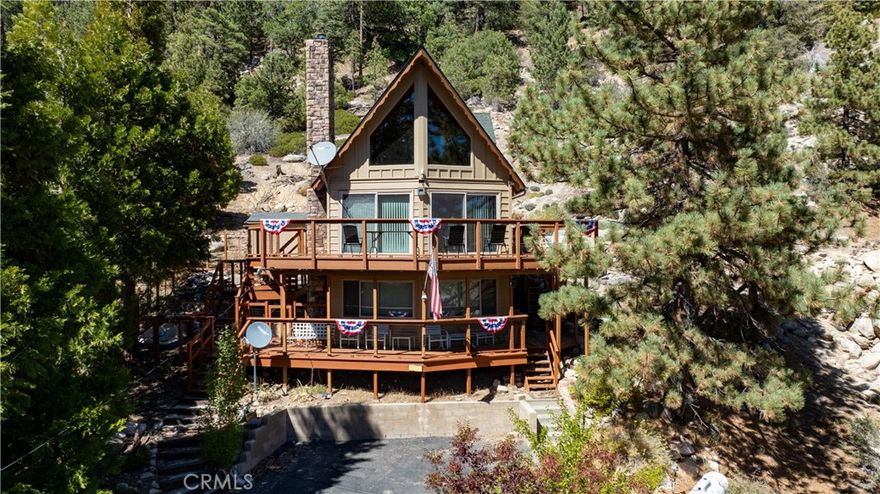 PRICING UPDATE!! Views for Days – And a Dock Rights, Too!

Love a good view? You’re going to fall hard for this place! With jaw-dropping 180° views of Big Bear Lake and the National Forest, this updated A-Frame cabin is right across the street from the lake — and yes, it comes with dock rights!



Kick back on the huge wrap-around deck and soak up the sun or watch the boats go by. Inside, you’ll find a remodeled kitchen and dining area, a cozy stone fireplace in the living room, and two comfy bedrooms, including an upstairs master suite with a gorgeous private bathroom and loft space.



Need extra space? Downstairs has a game room, hangout spot, or third sleeping area — complete with a second fireplace and half-bath. There’s even a workshop and extra storage out back.



.