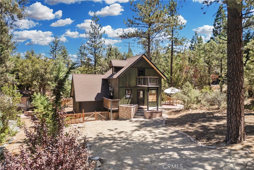 Some homes are meant to be lived in. This one is meant to be felt.
2204 Birchwood Way isn’t your standard mountain cabin. It’s an inspired retreat — a place where every surface, every fixture, every view feels like a canvas. The owners reimagined it from the ground up, keeping the character raw and expressive so the space could breathe. Exposed plumbing becomes sculpture. The kitchen feels like it’s always been here, yet functions like new.
In the living room, a wood-burning stove anchors the space — perfect for slow mornings with coffee or evenings spent swapping stories by the fire. Oversized windows fill the home with natural light, while the open layout creates a natural flow from cooking to conversation.
Step outside, where the property spans just under a quarter of an acre, and the creative energy continues — from sun-dappled patios to starlit decks, every corner invites a different mood. The fenced yard is perfect for pets or play, and the corner lot offers a little extra breathing room, just a short distance from Pine Mountain Club’s village, shops, and clubhouse amenities.
Whether you’re an artist searching for inspiration, a free spirit looking for a home that doesn’t feel like everyone else’s, or an investor ready to craft an unforgettable Airbnb experience, this is a space that sparks something the moment you walk in.
Ownership in Pine Mountain Club includes membership in the Property Owners Association, with dues of $165 per month. This provides access to a variety of amenities: an Olympic-style pool and spa, tennis and pickleball courts, a nine-hole scenic golf course, an equestrian center, and more. The community also offers essential year-round services like 24/7 patrol, trash and recycling pickup, road maintenance, and snow removal. For added peace of mind, Kern County Fire Station 58—equipped with paramedics and a helipad—is located right in the community to ensure fast emergency response when needed.