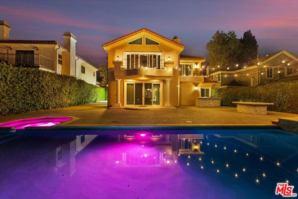 Mediterranean Elegance South of Ventura Blvd | 4 Beds, 4.5 Baths + Pool & Spa! Welcome to this beautifully appointed two-story Mediterranean home, perfectly positioned in the desirable Sherman Oaks neighborhood south of Ventura Blvd. Offering nearly 4,000 sqft of sophisticated living space, this meticulously maintained property features 4 spacious bedrooms (including a versatile first-floor bedroom), 4.5 baths, two inviting living areas, and luxurious finishes throughout.Upon entering, you're greeted by high ceilings, abundant natural light, and an open-concept layout ideal for both entertaining and comfortable everyday living. The gourmet kitchen is a chef's dream, complete with top-of-the-line Viking appliances, custom cabinetry, and a generous center island perfect for gatherings. The lush backyard is a true private oasis, showcasing a sparkling pool and spa surrounded by mature landscaping and ample patio space for al fresco dining, entertaining, or simply relaxing in the California sun.Retreat upstairs to the expansive primary suite, featuring a serene ambiance and spa-inspired bath with dual vanities, a luxurious soaking tub, separate glass-enclosed shower, and a spacious walk-in closet. Additional bedrooms offer generous space and privacy, ideal for family, guests, or home office use. Enjoy the convenience of living moments away from Ventura Blvd's finest shopping, renowned dining, and vibrant entertainment options. Available now for lease your Sherman Oaks Mediterranean dream home awaits!