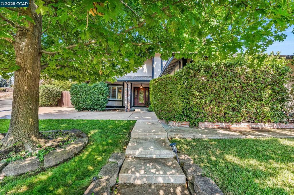 Welcome to 66 Midhill Rd in picturesque Martinez, a show-stopping 4 bedroom, 3 bath home that radiates elegance, warmth, and undeniable pride of ownership. Step inside and you’re immediately greeted by an open, airy floor plan with soaring vaulted ceilings and sun-drenched spaces that make every room feel inviting. The chef’s kitchen is a true standout, boasting gleaming stainless steel appliances, rich granite countertops, recessed lighting, and thoughtful finishes designed for both everyday living and effortless entertaining. A spacious downstairs bedroom with a full bath offers ideal flexibility for guests or multigenerational living. The oversized garage provides ample room for storage, hobbies, or a home gym, and yes, there’s even outdoor RV parking for all your adventures. Energy-efficient solar panels help keep utility costs low, while the backyard sanctuary stuns with a lush garden, peaceful koi pond, soothing waterfall, and meticulously curated trees and shrubs. This is more than just a home, it’s a lifestyle. Located in a charming small town with big city amenities close by, you're just minutes from restaurants, top-rated schools, and convenient freeway access. Prepare to fall in love. Homes like this don’t come around often, so schedule your private showing today!