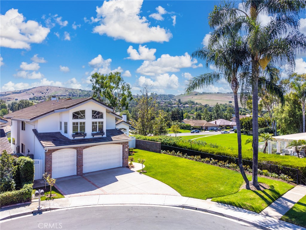 Rare 5 bed/3 bath home located in the highly desired community of Highland- Turtle Rock showcasing beautiful Bommer canyon and hillside views. Enjoy 3,115 sq ft of spacious living in this inviting home featuring wood flooring on the first level and carpet on the second, high vaulted ceilings and large floor to ceiling windows keeping the space nice and bright and expansive views in almost every room! Both the formal living room and family room boast a cozy fireplace with doors leading out into the wonderfully landscaped backyard perfect for entertaining loved ones. The dining room connects to the gourmet kitchen and features granite countertops and an island, ample cabinet space, fridge, stove, oven, microwave, and dishwasher. Upstairs you will find the master suite, with carpet flooring, its very own fireplace, and walk in closet. Attached is the master bathroom with dual vanities, soaking tub, and upgraded walk in shower. The additional bedrooms are oversized with built in fixtures, and large mirrored closets. The shared bath also has a dual vanity and a tile shower/tub combo. The laundry room comes with the full size stacked washer/dryer. Parking has never been easier in the 3 car garage with upgraded epoxy flooring.Award winning Bonita Canyon Elementary is within a short walking distance and to be followed by Rancho Jr High and University High School. For more information and to schedule a time to view, please contact us today.