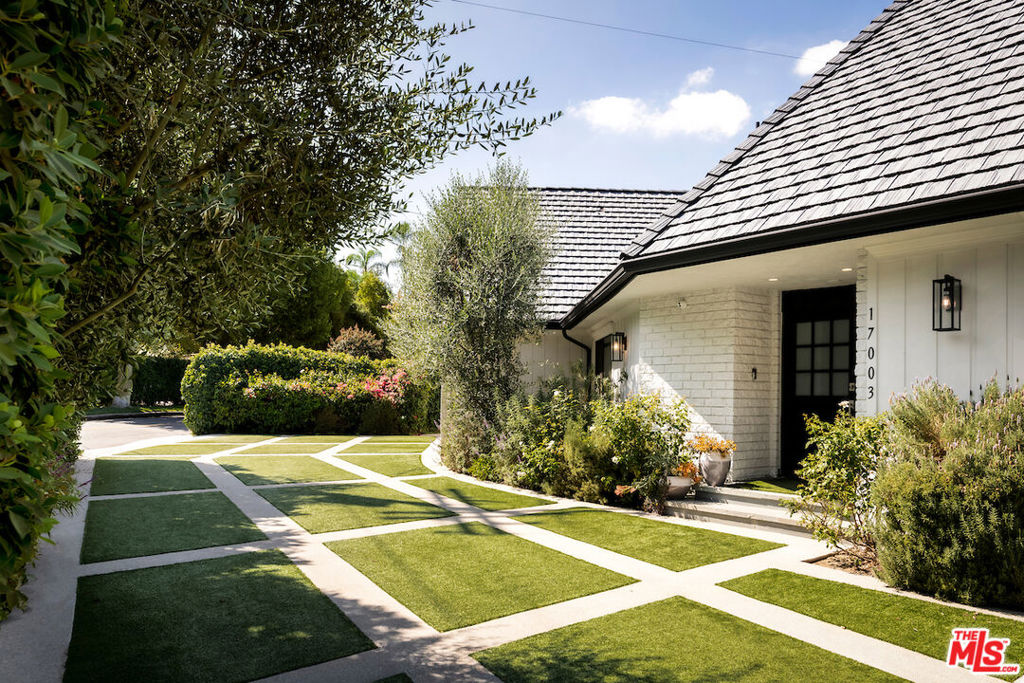 Tucked behind tall hedges in Rancho Estates, this Encino home offers comfort, space, and privacy for everyday living. Recently redone with a modern vibe, the main level features an open floor plan with living, dining, and a family room centered around a lovely fireplace with built in storage. Each space showcases wood flooring. The kitchen includes quartz countertops, a large center island with a prep sink, and a full butler's pantry with a wine/beverage fridge and walk-in storage. Upstairs, the primary suite offers dual closets and a large bathroom with a soaking tub, multi-jet shower, and double sinks. Outside, you'll find a turf yard, BBQ area, fire pit, and pool/spa. Designed for comfort, style, and easy living, this home is set in one of Encino's most sought-after neighborhoods.