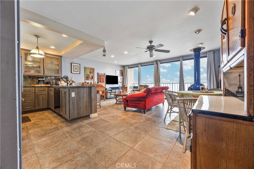 This 1-bedroom, 1-bathroom oceanfront condo in Redondo Beach features a 180-degree ocean view from the Palos Verdes Peninsula to Malibu. Positioned right above the beach with direct access, it includes amazing ocean and sunset views from the west-facing private balcony, ideal for morning coffee or downtime. The open living and dining space benefits from floor-to-ceiling windows that bring in plenty of light and fresh air. Highlights include a fireplace, a kitchen equipped with granite counters and stainless steel appliances, and a bedroom that opens directly to the bathroom. Laundry is available on the same floor, along with two parking spaces in the gated building's underground garage.  Easy walk to Redondo Beach Pier, King Harbor marina, or Riviera Village for restaurants, stores, and outdoor seating. Fully furnished and ready December 1st for a minimum 12-month lease.