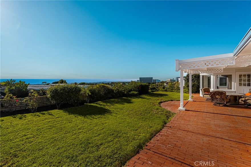 Breathtaking Single-Level Home with Panoramic Ocean Views! Experience coastal living at its finest in this beautifully remodeled single-story home showcasing sweeping panoramic ocean views from Newport Beach to Catalina Island and all the way to Pacific Palisades. Enjoy unforgettable sunsets from the living room, dining area, kitchen, and primary suite—every day feels like a vacation here. This 4-bedroom, 2.5-bath residence is being offered for lease for the first time, and it truly feels like home. Step inside to find a spacious, light-filled floor plan with no interior steps and walls of windows framing the stunning coastline. The large living room features a cozy fireplace and endless ocean vistas, while the separate family room offers custom built-in cabinetry for added storage. The updated kitchen includes newer stainless-steel appliances, a refrigerator, and a charming breakfast nook overlooking the sparkling Pacific. A Culligan whole-house water softener system and reverse osmosis filtration system (connected to both the kitchen sink and refrigerator) add extra convenience. All bedrooms are generously sized with ample closets. The primary suite is a true retreat with incredible ocean views, a remodeled ensuite bathroom featuring a walk-in shower and soaking tub, and a cedar-lined walk-in closet. The hall bathroom is equally impressive, remodeled with a new walk-in shower, double vanity, and skylight that floods the space with morning sunshine. Step outside to the grassy backyard, perfectly positioned to capture Newport’s gorgeous sunsets and cool ocean breezes—ideal for relaxing or entertaining. Additional features include an indoor laundry room (washer and dryer included) and an attached two-car garage with storage, plus the home was freshly painted inside and out.  Located in the desirable Broadmoor Hills neighborhood, this home offers easy access to Corona del Mar Village, Gelson’s Shopping Center, Fashion Island, and the local lawn bowling club. This exceptional home offers both luxury and comfort in one of the most sought-after areas of Newport Beach. Come see for yourself—the views are even better in person!