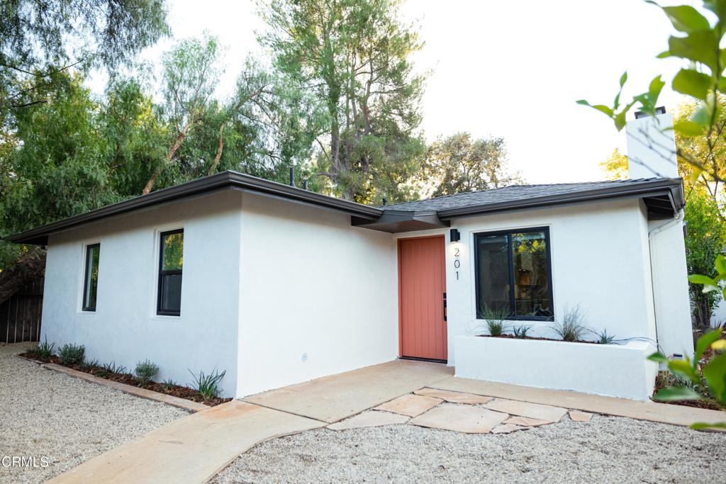 Nestled in the heart of downtown Ojai, 201 Fox St is a soulful 3-bedroom, 2-bathroom (plus office space) abode that captures the essence of relaxed Ojai living. With 1,135 sq ft of beautifully remodeled space, this home offers the perfect blend of charm, functionality, and creative energy. Step inside and feel instantly at ease. The light-filled interior is warm and inviting, with tasteful modern updates that honors Ojai's simplicity . The open living area centers around a cozy fireplace, beautifully accented with custom tile work--a perfect spot to unwind alone, with guests or family. The updated kitchen flows effortlessly with clean lines, natural textures, and thoughtful finishes throughout. The laundry/mud room is conveniently located next to the kitchen. All three bedrooms offer peaceful retreats, while the two remodeled bathrooms feature artistic, spa-inspired touches. Need a studio, remote workspace, or guest hideaway? The office, located just off the garage, is your flexible sanctuary--ideal for creatives, professionals, or quiet thinkers alike. Outside, the vibe is pure Ojai: mature trees, dappled sunlight, and space to gather, garden, or simply breathe. Additional upgrades include a newer electrical panel and quality finishes that make this home truly move-in ready. And the location? It's unbeatable. You're just a short stroll from downtown Ojai's charming shops, local cafes, farm-to-table restaurants, and the iconic Libbey Park--perfect for live music, community events, or a quiet afternoon under the oaks. Experience the Ojai's finest living - 201 Fox St is ready to welcome you home. ***ADU PLANS AVAILABLE UPON REQUEST***