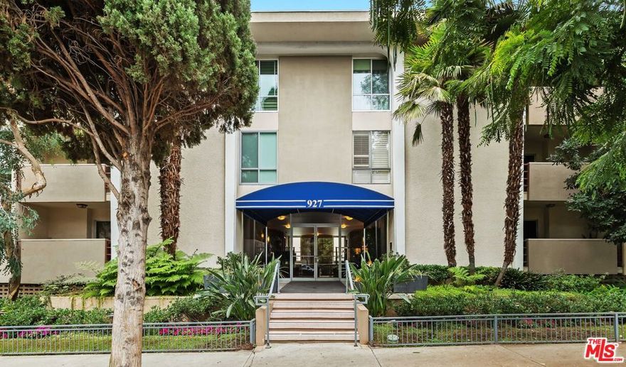 Welcome to Unit 212 located in the vibrant heart of West Hollywood, moments from Melrose Place and Santa Monica Boulevard. This bright and spacious 2 bed, 2 bath corner condo spans 1,280 square feet and offers an open living area with a fireplace, dining room, and private balcony with treetop views. The updated galley kitchen is equipped with stainless steel appliances, quartz countertops, and luxury vinyl flooring. The spacious primary room features a walk-in closet and ensuite bathroom with double vanity. The versatile second bedroom is perfect for guests or a home office, with an adjacent full bathroom. Several recent upgrades including new dual-pane windows throughout and a new water heater. There is also an option to install an in-unit washer and dryer with HOA approval. Additionally, the condo comes with two side-by-side parking spaces in a secured parking garage, with the option to add an EV charger. Located in a well-maintained building with a secured entrance, updated lobby, courtyard pool, and two laundry rooms on every floor. HOA fees include water, trash, earthquake insurance, high-speed internet, and premium cable.