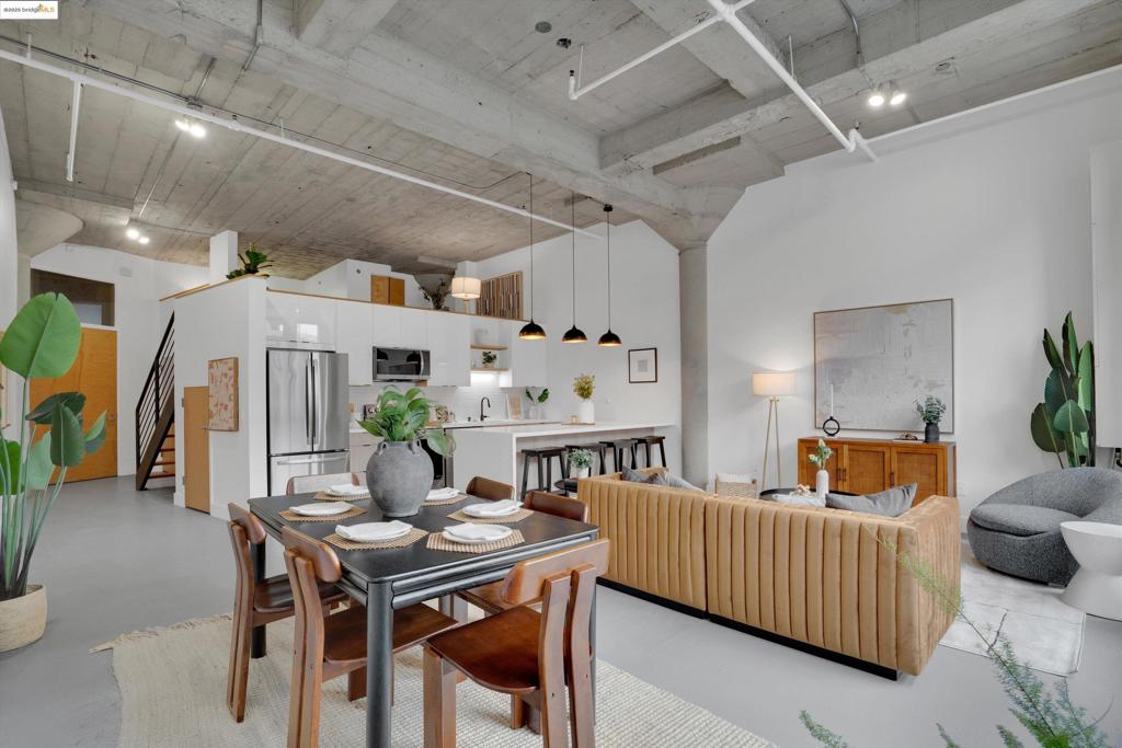 Modern Industrial Loft Living in the Heart of Jack London Square Welcome to Tower Lofts—one of Oakland’s most iconic live/work buildings in vibrant Jack London Square. This bright, spacious loft features soaring ceilings, floor-to-ceiling industrial windows, and polished concrete floors that flood the space with natural light. The open-concept layout is ideal for entertaining or creative work, with a newly updated kitchen boasting a waterfall peninsula island, quartz countertops, and new stainless steel stove and microwave. The living area opens to a large private balcony—perfect for morning coffee or evening wine. The generous bathroom offers a dual sink vanity and tiled shower. Enjoy in-unit laundry and one assigned space in a secured garage. Exposed beams and flexible space make this ideal for a home office or studio. HOA dues include gas and electricity. Residents also enjoy a rooftop deck with skyline views and BBQ area. Located in a Walker’s Paradise (Walk Score 94), near BART, Amtrak, SF Ferry, dining, breweries & more. Easy freeway access, Bike Score 85, and just a 10-minute drive to the Bay Bridge.