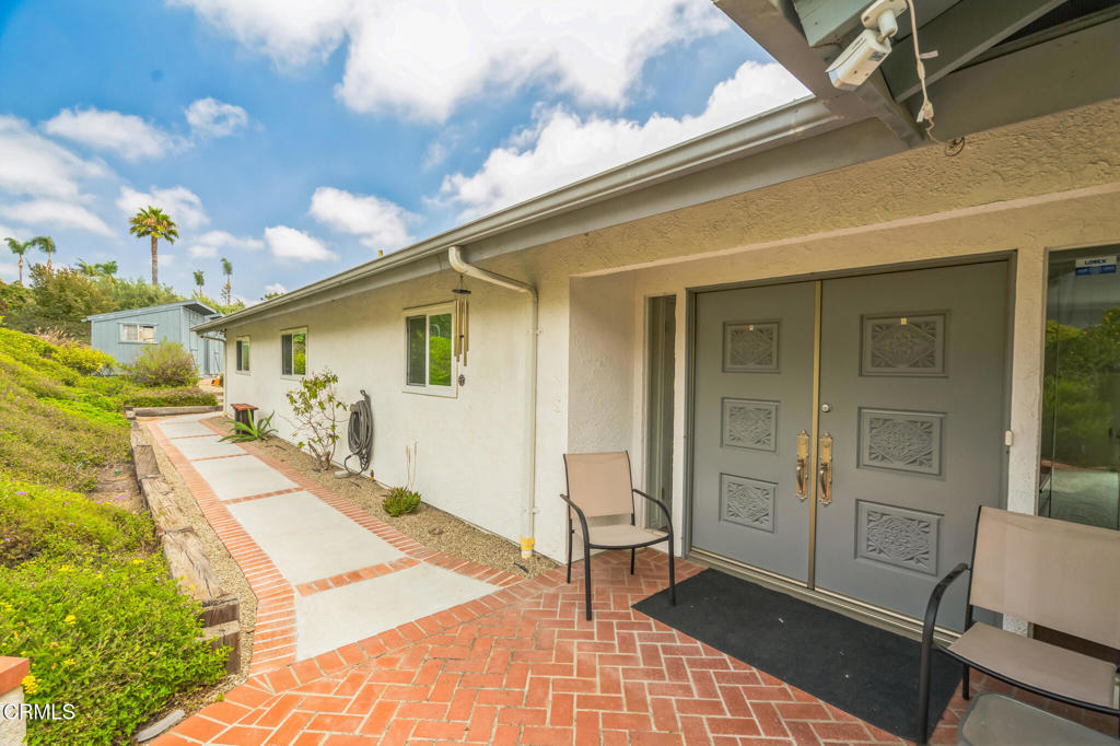 Seller has priced this home to sell. Stunning single-story ranch with panoramic mountain views in one of Camarillo's most desirable neighborhoods. This 4-bedroom, 2-bath home features a gourmet kitchen with granite countertops, Wolf induction cooktop, Dacor double oven, KitchenAid dishwasher, and built-in microwave. Walk into a inviting living and family room separated by a fireplace. Wonderful breakfast area with views to the 'Grade'. Separate laundry room with easy access to the 2 car attached garage.. Center hall leads you to the 4 bedrooms. The rear patio is perfect for afternoon relaxation. Top stay cool in the summer months your have a Tassio A/C system provides year-round comfort. Set on an almost 20,000 sq. ft. lot, the property includes a mature orchard with avocado, orange, grapefruit, apple, apricot, and plum trees, offering fresh, homegrown produce. Two all-weather sheds (11' x 13'), including one soundproofed for creative or professional use, plus a 40-foot shelter with zippered doors add function and flexibility. A full-property security system with garage and yard coverage, along with quality exterior lighting, ensures peace of mind. The spacious tiered lot with a separate driveway entrance offers room to expand; whether you envision a pool, guest house, or simply enjoy the privacy and open space. Blending modern upgrades with natural beauty, this Camarillo ranch is a rare opportunity to own a home that's both practical and inspiring.