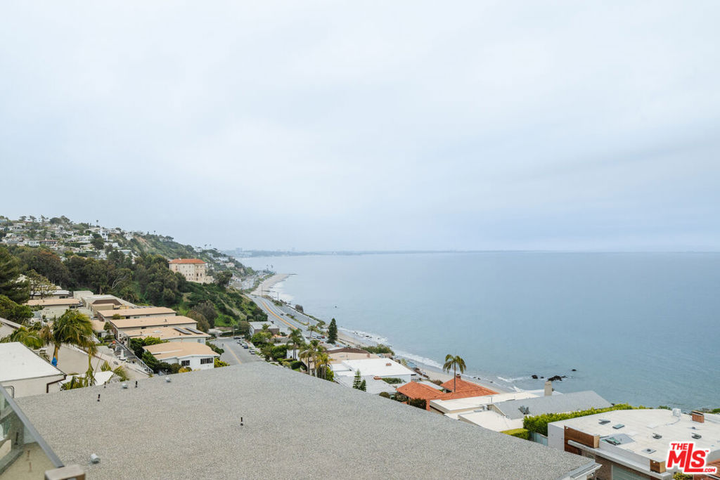 A rare opportunity to rebuild and keep your California dreams alive. This top-floor, single-level retreat offers breathtaking unobstructed Ocean and Coastline views from Palos Verdes to Malibu and even the Getty Villa, which just reopened and visible from your spacious, outdoor balcony. Enjoy one of the largest private outdoor living spaces on Coastline, perfect for morning coffee, dolphin watching, and sunset views. Just one block from the newly reopened Gladstones, this peaceful sanctuary feels like a private penthouse with seamless indoor-outdoor living, floor-to-ceiling glass doors, featuring breathtaking Ocean views from both your primary living room and bedroom. Come home to inspiration, beauty, and a fresh start by the sea.