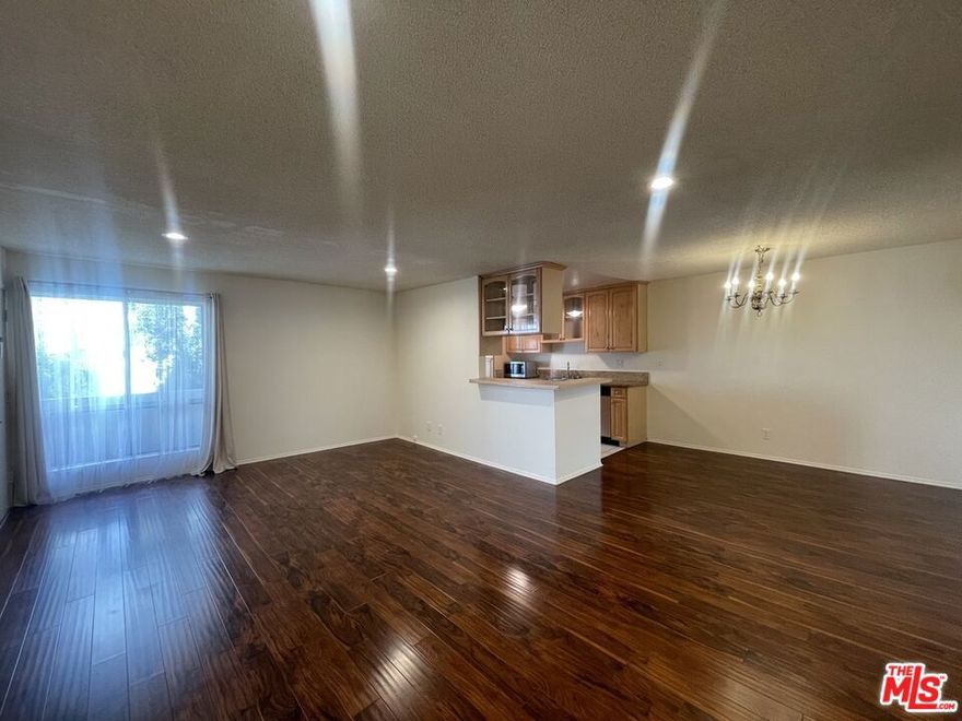 Experience peaceful living in this inviting 2-bedroom, 2-bath condo offering 1,051 square feet of thoughtfully designed space. Tucked away in a quiet 13-unit community, it's an ideal retreat for those who value comfort and calm. Inside, you'll find hardwood floors, recessed lighting, a spacious open layout, and a private patio perfect for unwinding outdoors. The primary suite includes a walk-in closet and ensuite bath with vanity, and shower, while the second bathroom features a relaxing bathtub. The kitchen is upgraded with sleek countertops, stainless steel appliances, plus a new refrigerator and dishwasher for everyday ease. Residents can enjoy the building's amenities, including two swimming pools. Water and trash are covered, and only electricity is the tenant's responsibility, making for low-maintenance living. Perfectly situated in Encino, the building is located just off of Ventura Boulevard, near local dining and shopping hotspots. Don't miss your chance to enjoy the best of serenity and convenience!