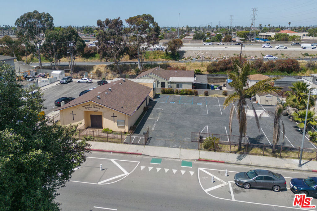 We are pleased to present an exceptional opportunity to acquire an approximately 11,064-square-foot parcel zoned C2-1VL-CPIO, TOC Tier 3, in South Central Los Angeles. The site is currently underutilized, featuring a 1,857-square-foot church structure and an additional bungalow that does not appear to be affixed to the land. Property uses include recycling center, tow yard, vehicle storage, property storage, auto service, auto body work, construction equipment storage, tire supplier, community services. With significant development potential, the CHIP Ordinance density bonus rules estimate a maximum of 59 units, though required open space and bicycle parking provisions reduce the total buildable units to 56. Using the TOC Tier 3 density rules, the site allows for up to 48 units, providing another viable option for maximizing density. Using ED1 100% affordable housing density rules, the maximum allowable units are 49, with open space and parking requirements limiting the total to 46. At $71.85 per square foot of land and just $14,196 per buildable door, this offering presents an exceptional value for developers. With Los Angeles facing a persistent housing shortage and strong rental demand, this property is well-positioned for a high-impact development that aligns with the city's urgent need for more housing. The property is also conveniently located near several parks and recreation centers, including the Green Meadows Recreation Center, which offers a variety of sports facilities and community programs, and the Mary McLeod Bethune Park, featuring playgrounds and picnic areas, both within a mile of the site.