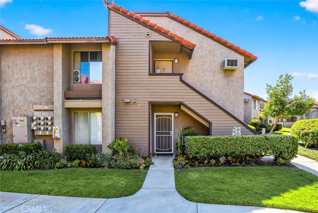 Welcome to one of the best-kept secrets in Corona! A peaceful, ground-level 1 bedroom, 1 bathroom condo in the highly desirable Windwood community. This charming home is perfectly suited for anyone seeking an easy, low-maintenance lifestyle. Ideal for those looking to downsize, simplify, or enjoy single-level living with no stairs to navigate. Tucked away in a quiet, serene corner of the community, this condo offers the ultimate in convenience. Just steps from all the amenities including the sparkling pool, laundry facilities, mailboxes and two assigned parking spaces. Everything you need is close by. Plus, with water and trash included in the HOA, your only utility bill is electric, making for a truly stress-free experience. Inside, you’ll find a spacious living room with updated window coverings that allow natural light to pour in while maintaining privacy. The open layout connects the living area seamlessly to the kitchen and dining space, creating a comfortable and functional flow for everyday living. The spacious bedroom features a generous walk-in closet, and the kitchen includes a rare walk-in pantry for all your storage needs. Step outside to your private patio with a peaceful view, the perfect spot to enjoy a morning coffee or unwind in the evening. An efficient air conditioning unit keeps the home cool and comfortable year-round. If you’re looking for quiet comfort and simple, convenient living, this lower-level gem in Windwood is ready to welcome you home.