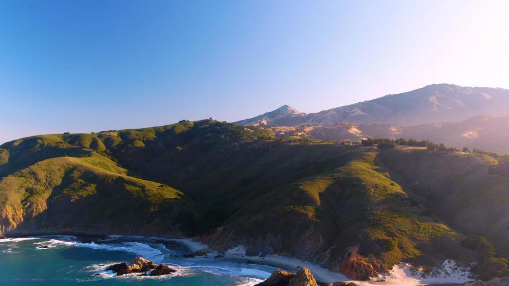 Clear Ridge Estate: Spanning 80 acres of pristine Big Sur coastal land perched above the Pacific Ocean, this unique estate features two exquisite homes 700 feet directly above Pfeiffer Beach with spectacular 360* views and so near to Pfeiffer Beach you can hear, see, and almost feel the crashing waves.The property consists of 2 separate legal parcels, each with its own residence over 600 feet apart on either end of a rare 5-acre natural ridge top meadow.The 2 homes total almost 5,000sq.ft. with 5 beds & 4 baths, built with the highest quality construction standards and materials.The North House, at almost 3,200 sq.ft, is the centerpiece of the property.It has all the amenities one would expect for a property of this caliber. Surrounding the home are meandering stone patios, pathways, arbors, gardens a great lawn and hiking trails in your own redwood forest. The South House at 1600sq.ft. has commanding ocean and mountain views.This is the perfect legacy property in the heart of Big Sur.