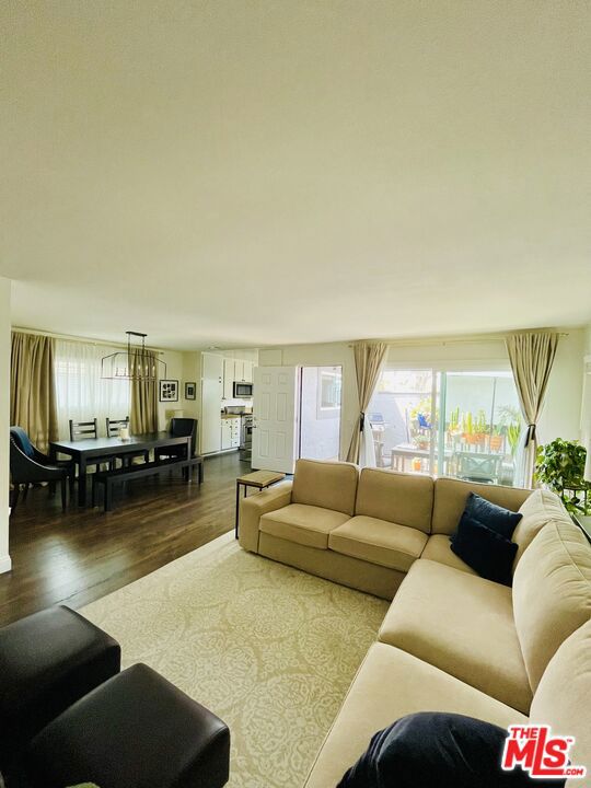 Location, Location, Location!!! Welcome to this charming 2-bedroom upper-level private staircase unit with no one living below you, in the very desirable Yorktown Villas community in the heart of Huntington Beach. The unit has a spacious living room, dining area, and bedrooms with indoor laundry! The unit will include all kitchen appliances, and an LG stacked washer and dryer set! Recent upgrades include an HVAC system replaced 2 years ago, Mohawk Revwood laminate flooring, Double-Pane Windows and sliders, and window blinds throughout. Bright and sunny unit with terrific balcony for outdoor enjoyment. The unit is clean, well-maintained, and move-in ready. The unit comes with one assigned carport and a storage cabinet. Association amenities include a pool, playground, and lush green spaces. There's also a 1-keyed laundry room shared between 4 units (should you desire to use it), and 4 guest parking spaces. This property was fully painted on the exterior by the HOA last year, and it will be delivered freshly painted on the inside. All of this in a terrific ocean-close area! Award-winning schools are nearby, and it's conveniently located close to shopping centers, restaurants, entertainment, major attractions, and with easy access to freeways. This unit offers an unparalleled lifestyle in a fantastic location! For showings and additional information, please call directly.