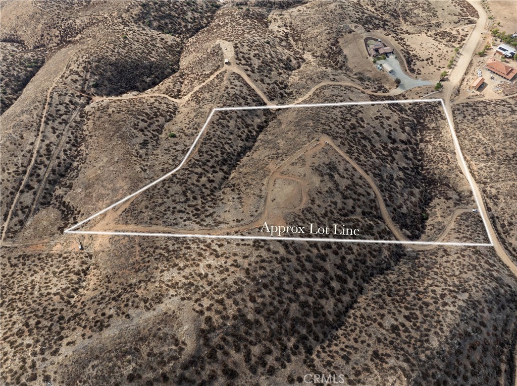 This beautiful 20-acre parcel of vacant agricultural land offers a unique blend of rural tranquility and convenient access to amenities. Approximately 3/4 of the property has been fenced and surveyed, providing a secure and clearly defined boundary. A previously approved pad site, grading permit, reviewed and approved by the county, simplifies the initial steps of construction. Essential groundwork has already been completed with a successful percolation test for septic installation and a functioning water well, saving significant time and expense. The property's desirable location is surrounded by custom homes, offering a sense of community while still maintaining a private, spacious feel. Just 20 minutes from Temecula, this land provides easy access to renowned wineries, restaurants, shopping, and entertainment, making it an ideal canvas for your dream agricultural estate.