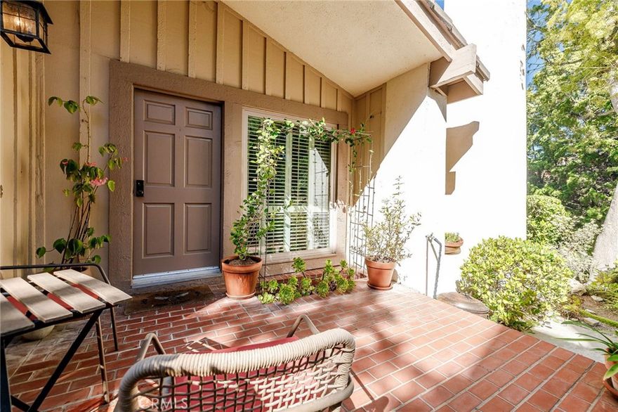 This private, beautifully upgraded split-level end unit townhome with 2 bedrooms plus a permitted 194 square feet bonus/bedroom, is ideally located in the highly desirable "Mira Verde" complex in Palos Verdes. The main level features a step down living room, with a heartwarming fireplace, a large window plus sliding glass doors looking out to the inviting, & serene patio.  There is also a conveniently located bedroom on the main level plus a tastefully updated bathroom with shower.  Stairs lead you up to the second level, where you find the dining/family room with sliding glass doors leading to a cozy balcony and an upgraded kitchen. A light-filled master suite with high ceiling and an ensuite bath completes this level.  On the lower level, you will find  a spacious bonus room (permitted as a third bedroom). The two car attached garage with direct access, EV charger and laundry area completes this level.  Other outstanding features include engineered hardwood floors throughout, water softener, central heating and air, recessing lighting and upgraded windows. The professionally landscaped and maintained Mira Verde Community includes two swimming pools, jacuzzi, tennis courts, sports courts and club house.  Plenty of guest parking. This is an extraordinary residence surrounded by the loveliest sense of community, parks, shopping centers and award winning schools.