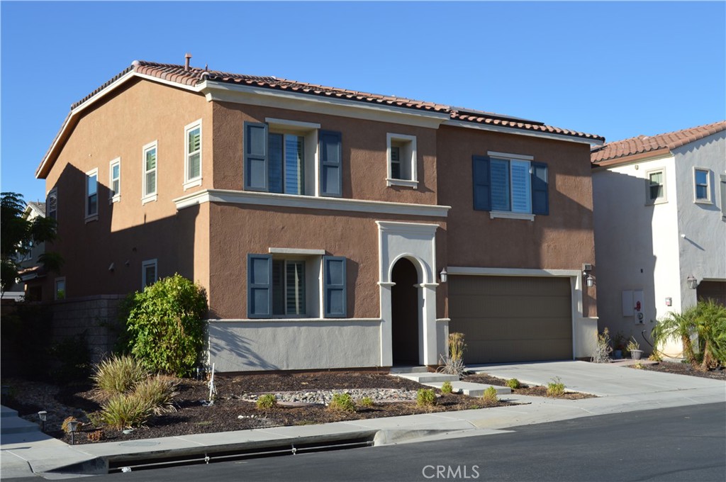 This stunning pool home is located within the gated community of Westridge in Canyon Hills. It boasts a large floor plan with 4 bedrooms, 3 baths, and a loft. The living room sits aside from an open kitchen with a full backsplash, granite countertops, double oven, large island and dining area. Great open floor plan for entertaining! Many upgrades to this home include solar, whole house fan, crown molding, plantation shutters, smart home light features, security cameras, ceiling fans, surround sound, large stackable sliding door, custom closets in master, custom garage cabinets, epoxy floor in garage, and a sparkling in-ground pool/spa with waterfall features. A main floor bedroom offers flexibility as an office or guest room. If this wasn't enough, the community offers a basketball court, playground, dog park, pool/spa, BBQ area and firepit. This home is a delight and located close to freeway access and shopping!