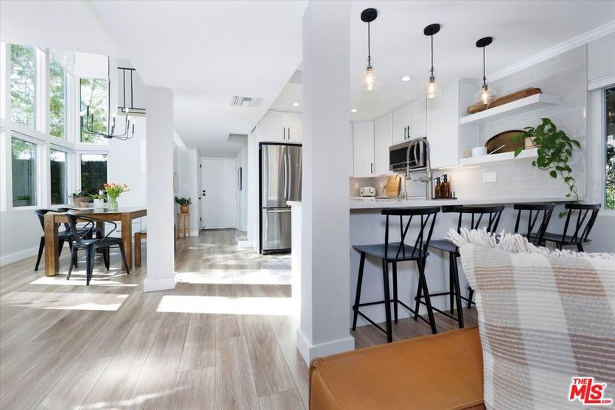 Welcome to this stunning, fully renovated townhouse that feels like a single family home with no shared walls and a private backyard. Located in the heart of Calabasas, featuring 3 spacious bedrooms, 2.5 bathrooms, and a versatile loft perfect for a home office, gym, or playroom. Ideally situated just minutes from The Commons, the Calabasas Farmer's Market, Lake Calabasas, and the Calabasas Tennis & Swim Center, this home offers the perfect blend of luxury, comfort, and convenience. Step inside to find an abundance of natural light, soaring cathedral ceilings, and a bright, open floor plan designed for modern living. The chic, remodeled kitchen boasts premium finishes, stainless steel appliances, and stylish cabinetry, all opening seamlessly to the dining and living areas. Enjoy updated flooring throughout, a private oversized patio and backyard ideal for entertaining, and a large two-car garage with direct access plus driveway parking for two additional vehicles. Community amenities include a resort-style pool and spa within a secure, gated complex, offering peace of mind and a true sense of exclusivity. This rare end-unit is spacious, private, and beautifully appointed. Don't miss this exceptional opportunity to own a turnkey home in one of Calabasas's most desirable neighborhoods.