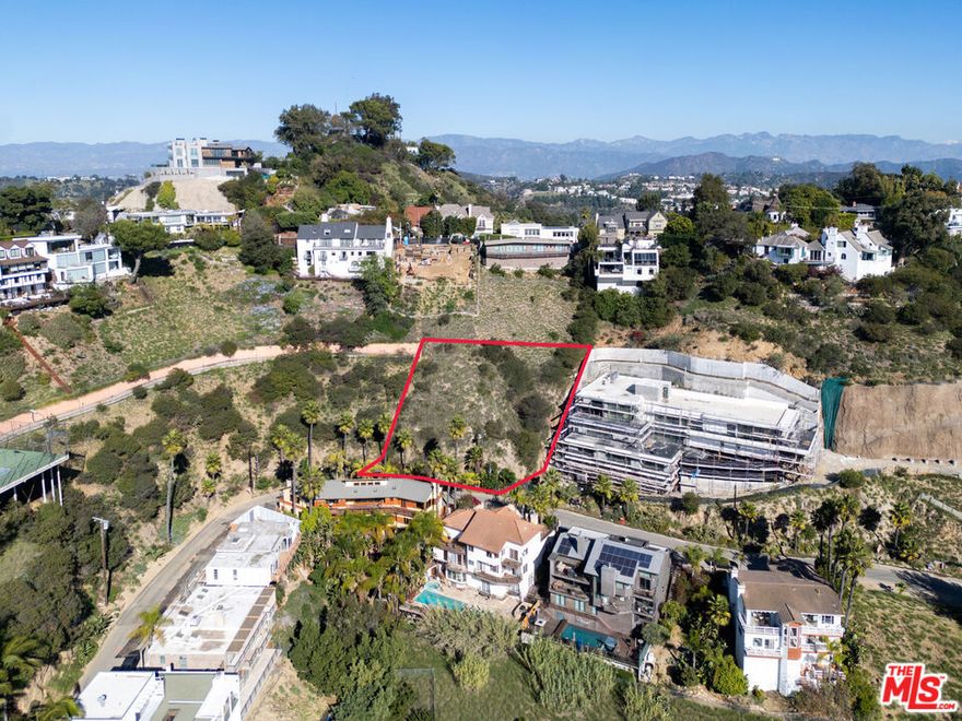 We are proud to present a fully RTI luxury single-family development opportunity on one of the most prestigious streets in the Hollywood Hills. Designed by COSI Designs, this modern hillside estate is thoughtfully planned on an approximately 9,378 Sq.Ft. lot, offering a rare combination of panoramic views and privacy. The current plans call for a +/-4,451 Sq.Ft. multi-level residence featuring four bedrooms and six bathrooms, highlighted by a primary suite that captures city views spanning Downtown, Beverly Hills, and Century City. Enjoy seamless indoor-outdoor living with multiple decks and terraces throughout, an infinity-edge pool and spa, and terraced garden spaces supported by integrated retaining walls. This home is designed as Type III-B construction, fully sprinklered under NFPA-13, Title 24 compliant, and includes a rooftop solar array of approximately 250 Sq.Ft.. The layout includes three levels above a two-level basement with direct access to an attached garage. An exceptional investment surrounded by luxury, this site neighbors multiple $20M+ estates in development and is directly beside a newly built home valued at $15M. Just minutes from the iconic Sunset Blvd., premier dining, luxury shopping, and world-renowned entertainment, the location offers both convenience and exclusivity. Utilities, including water, power, and sewer, are located within 50 feet of the property. A one-of-a-kind Hollywood Hills new construction opportunity with trophy views and unmatched potential.