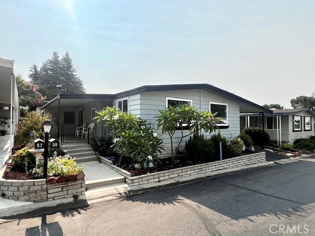 Upgraded and move in ready!!! Welcome to Valencia Lea, Highland’s premier +55 community! This 2 bed 2 bath 1973 Sunnybrook 1440sqft home has great curb appeal, lush mature landscaping with new paint, new dual pane windows, and a large porch! This home features new texture and paint, new lighting, and new durable luxury vinyl plank flooring. The large open living and dining areas feature HUGE picture windows, letting in tons of natural light, and built-in dining room cabinets. The upgraded kitchen features new cabinets and counter tops and includes all appliances! Just off the kitchen is the large family room with slider to the patio, perfect for informal living. The guest bedroom and nearby guest bathroom features tub shower combo perfect for your visiting friends and family. The large primary bedroom features two closets and vanity/dressing area with attached bathroom with glass enclosed low-threshold. The back yard is the perfect blank slate, ready for your garden. The attached storage bonus room gives you flexibility and the full-length carport includes storage shed. Don’t delay in taking a tour!