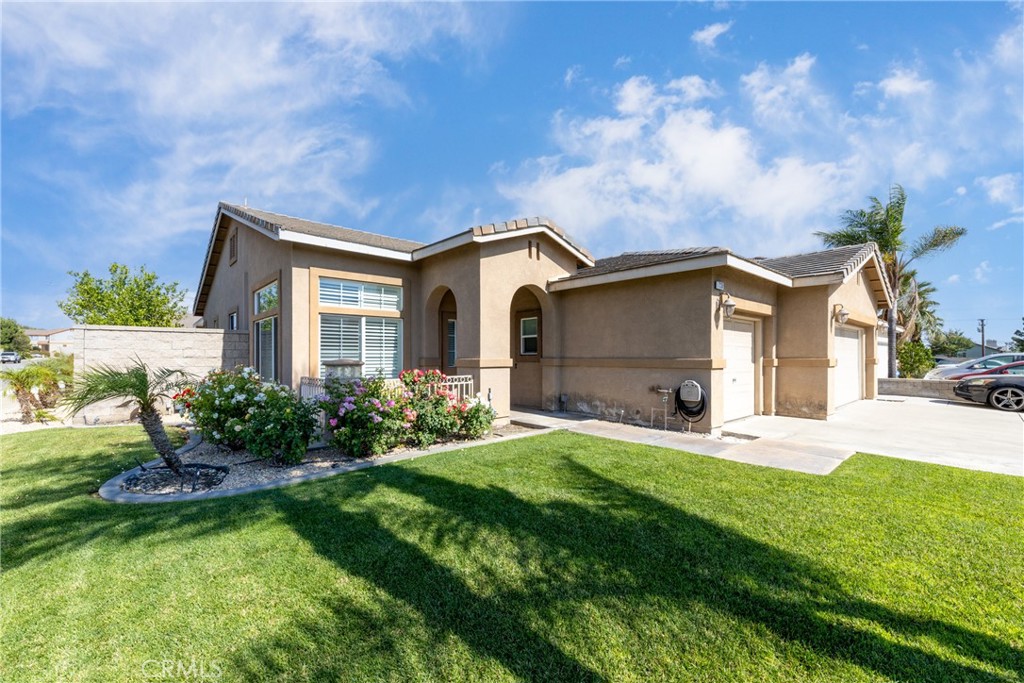 Welcome to a home where pride of ownership truly shines! This charming single-story residence, ideally situated on a corner lot in a highly sought-after North Fontana neighborhood. Originally a 4-bedroom, 2-bath home, the original owners have thoughtfully enhanced the living space. While unpermitted, the expertly converted 3rd car garage now provides an additional bedroom, a convenient half bathroom, and a dedicated laundry room, effectively making this a 5-bedroom, 2.5-bath home. The workmanship in this conversion is of excellent quality and presents beautifully, seamlessly integrating with the rest of the home. Buyers and Buyer's Agents are advised to conduct their own due diligence regarding this modification.
Discover a flowing open-concept floor plan that is in move-in condition. The heart kitchen, boasts abundant cabinetry, ample counter-space, a durable sink, and an overflowing island breakfast bar with direct backyard access. It flows seamlessly into the adjacent dining area and a cozy family room with a gas-burning fireplace, making entertaining a breeze. The thoughtfully remodeled den features a convenient pocket door leading to the laundry room and a dedicated office area, offering privacy and functionality.
The generously sized primary suite features a custom walk-in closet and a bathroom with a mirrored sink vanity, a walk-in shower, and a separate tub. The guest bathroom has also been tastefully remodeled.
This home is an outdoor entertainer's dream! The expansive 7,230 sq ft corner lot provides plenty of parking with a wide driveway and a two-car garage. You'll love the permitted RV access, complete with a wide 17 ft sliding gate and full electrical and water hookups, perfect for your recreational vehicles. A long aluminum patio cover extends across the back, providing ample shade for your BBQ area.
Assigned to an award-winning Etiwanda school district. With easy access to grocery stores, parks, and the 15 & 210 freeways, this home offers both tranquility and convenience. Don't miss the opportunity to make this captivating property your own just in time to enjoy the end of summer!
