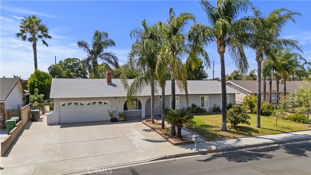 Here is your opportunity to get yourself a home with ENDLESS OPTIONS! This great ranch style home with tons curb appeal offers 4 very large bedrooms and 2 bathrooms. The kitchen has been remodeled with new cabinets and granite counter tops. The roof was replaced in Dec. 2023, windows were replaced with dual pane vinyl throughout, the heater was replaced as well as the water heater in 2022. You like fruit trees....... THERE ARE 14 DIFFERENT VARIETES!! Were talking Avocado, Peach, Lemon, Lime, Grapefruit, Tangerine, Papaya and many MORE! The best part of this deal.....The lot. At 18,000 ft, there is plenty of room for an income generating ADU or bring our folks, with plenty of room to spare. It's also zoned for animals so bring your horses and chickens! A lot this size has not been on the market in this area for quite some time now. Don't miss out on this opportunity, CALL NOW!! Professional phots along with Drone photos coming soon.