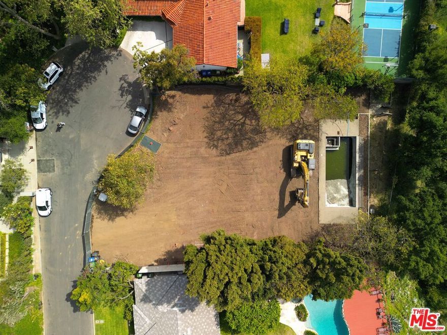 Welcome to 13741 Romany Drive - an extraordinary opportunity in the prestigious and picturesque Palisades Riviera, one of Los Angeles' most coveted neighborhoods. Nestled at the end of a quiet cul-de-sac, this expansive 12,826.7 SQFT lot is complemented by an additional 3,641 SQFT lot that will be merged into the property, creating a rare 16,467.7 SQFT estate site with sweeping canyon views that stretch across Will Rogers State Park and into the Santa Monica Mountains. The property comes with RTI (Ready-To-Issue) permits and fully approved architectural plans by renowned architect Karen Putman for a stunning 8,564.81 SQFT Modern Spanish-style estate, thoughtfully designed to embrace the natural beauty of its surroundings. Just minutes from Palisades Village, top-rated schools, scenic hiking trails, and the iconic beaches of the Pacific Coast, this property pairs tranquil seclusion with unmatched convenience. Whether envisioning a dream residence or pursuing a high-value development, 13741 Romany Drive is a rare canvas - complete with world-class architectural plans, permits in hand, and premium materials to bring the vision to​​‌​​​​‌​​‌‌​​‌​​​‌‌​​​‌​​‌‌​​​‌​‌​​​‌‌​ life.