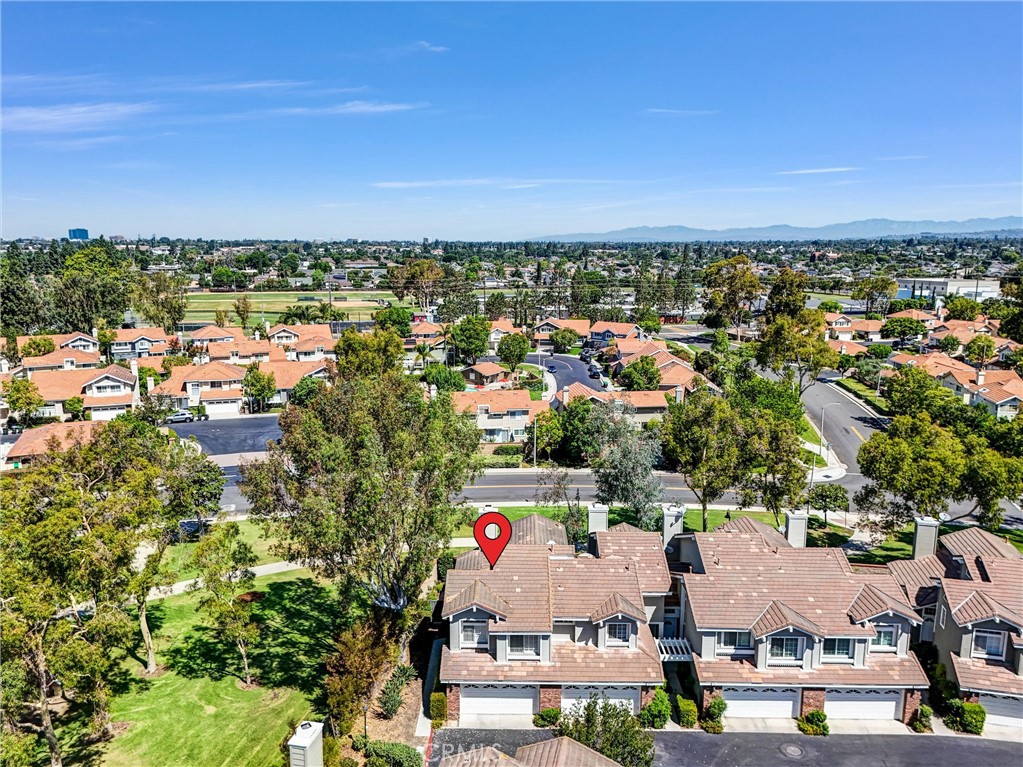 Prime location! Stunning End-Unit Home in Highly Desirable Sycamore Glen, Tustin Ranch! This beautifully upgraded 3 bedroom, 2.5 bath home shares only one wall with a neighbor, offers the perfect blend of comfort, functionality, and style. Step inside to a spacious, light-filled floor-plan with new vinyl flooring and fresh paint. The open-concept living room, boasts soaring ceilings with added recessed lights, abundant natural light, and a charming brick fireplace—creating an inviting atmosphere for relaxing or entertaining. The kitchen offers a granite countertops, a gas range, ample cabinetry, and a convenient breakfast bar for casual meals. An adjacent versatile room offers endless possibilities—use it as a formal dining area, home gym, or a home office. Upstairs, you’ll find three spacious bedrooms featuring ceiling fans, mirrored wardrobe doors and new installed vinyl floors. Outside, enjoy your private wraparound patio, perfect for al fresco dining or quiet mornings. The attached two-car garage provides ample storage with custom cabinetry and direct access to the home. As a resident of Sycamore Glen, you'll enjoy access to a refreshing community pool and spa, and just steps away from El Camino Real Park. This prime location is close to top-rated schools including the award-winning Beckman High School, and just minutes from the Tustin/Irvine Marketplace, with easy access to the 5 freeway for convenient commuting. Don’t miss this rare opportunity—schedule your private showing today!