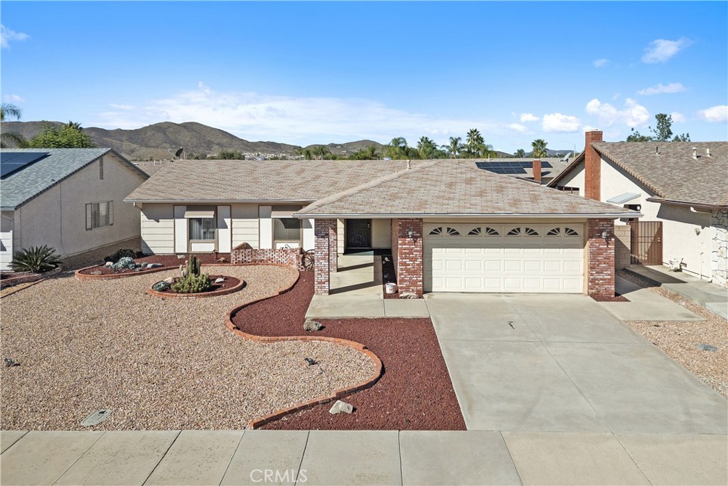 Welcome to this well-maintained 2-bedroom, 2-Bath Home in a desirable 55+ senior community — with no HOA fees. The front and back yards showcase water-wise landscaping, while leased solar panels help reduce energy costs. Inside, the bright open floor plan features a cozy fireplace in the living room, flowing into the dining area with a sliding glass door opening to the covered patio and large backyard with block walls for privacy. Laminate flooring adds warmth and a separate den that could also be used as an office.
The open kitchen offers Corian countertops, tile flooring, recessed lighting, and abundant storage in beautiful cupboards. The primary bedroom features a vanity and walk-in closet, while the bath has a granite countertop and therapeutic walk-in tub with hydro massage jets — perfect for relaxation. The guest bedroom has large closets and access to the guest bathroom with a granite countertop. A separate laundry room sits conveniently off the kitchen with access to the back porch and garage.
Located in a quiet, established neighborhood close to shopping, dining, local wineries, and medical facilities, this home combines comfort, convenience, and low-maintenance living – all without the added cost of HOA dues. Residents are able to attend the Sun City Civic Association clubs as guests, offering the best of both worlds!