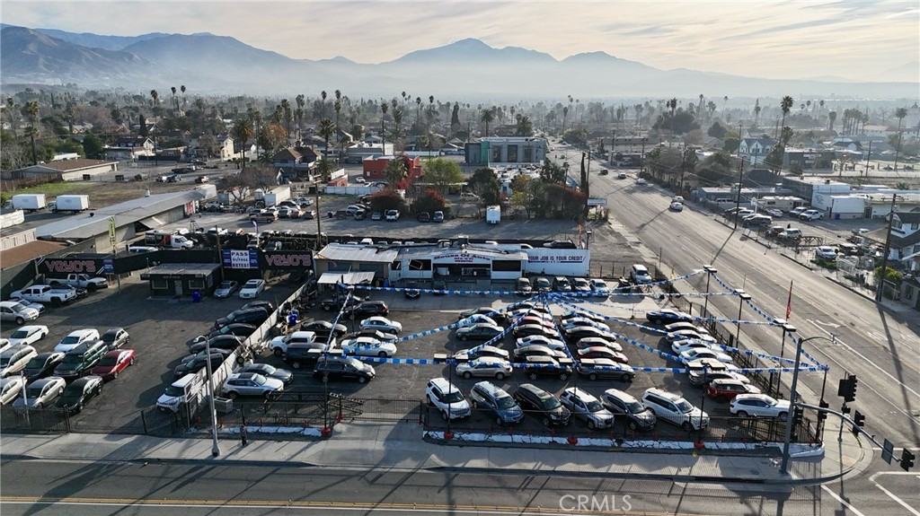Discover a prime commercial opportunity at 901 N E Street in San Bernardino, currently utilized as an auto dealership and being sold vacant, free of tenants. Situated on a high-visibility stretch of N E Street, this expansive lot features ample parking, excellent street frontage, and easy access to major thoroughfares—making it an ideal setting for a variety of businesses. The property’s open-concept layout and dedicated office space provide flexibility for a showroom, customer service area, or administrative needs. With its central location close to downtown amenities and highways, this turnkey dealership space offers endless potential for new ownership to establish or expand a commercial enterprise in a thriving market. Don’t miss the chance to capitalize on this exceptional investment. Two lots to be included in the sale APN: 0140-151-27 and 0140-151-28. Sale of the property includes transferable license.