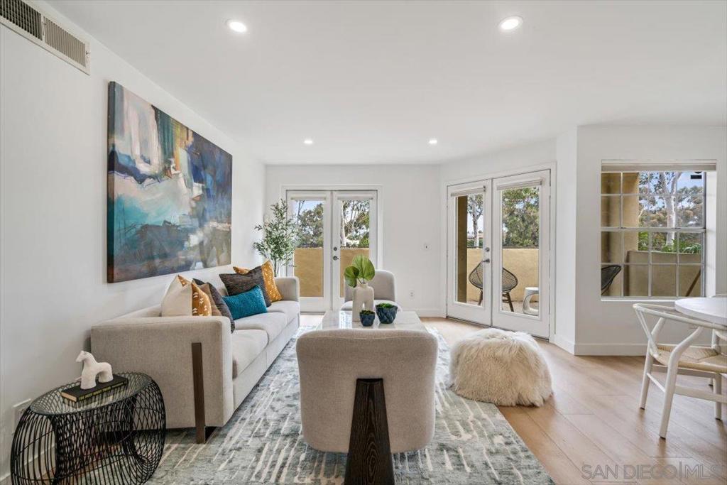 Located in the vibrant Uptown District, this inviting 2-bedroom, 2-bath corner-unit condo features a seamless single-level layout bathed in natural light from big, bright windows. Thoughtful upgrades include wide-plank luxury vinyl flooring, recessed lighting, and fresh interior paint throughout. Both bathrooms were renovated in 2024 with timeless finishes, including elegant tile-work and stylish vanities. The kitchen is freshly designed with granite countertops, sleek cabinetry, and a contemporary backsplash. The home also includes central AC, in-unit laundry, and two private patios—one of the largest in the complex. Set within a secure, gated community, residents get to enjoy resort-style amenities such as a sparkling pool, spa, fitness center, BBQ area, and beautifully maintained landscaping. Furthermore, the community offers a dog park, elevator access, on-site management, and two assigned underground parking spaces. Just steps to Trader Joe’s, Ralphs, popular dining spots, entertainment, and the lively weekly farmers’ market—this home truly has it all.