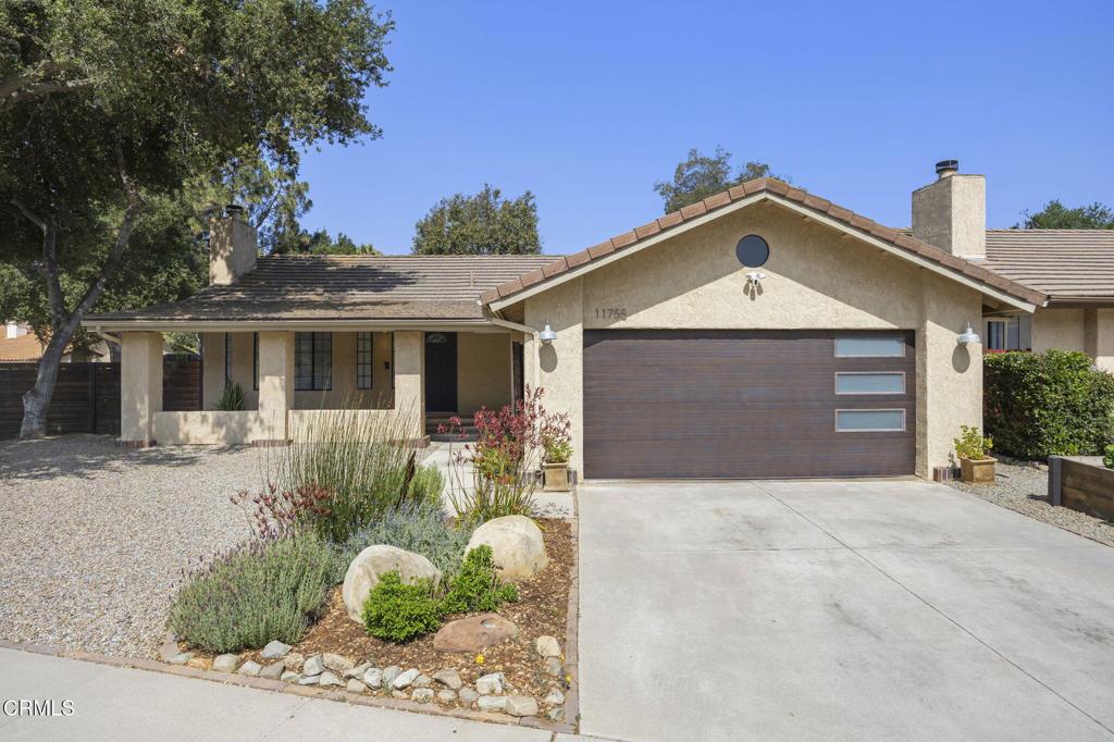 What a relaxing and lovingly-cared for Ojai neighborhood home on a spacious corner lot! With two bedrooms and two updated bathrooms, this cherished former model home is ready for its new owners. The private backyard is built for enjoyment and outdoor living with a bar, variety of low maintenance foliage, fire pit, and raised garden boxes. Recent upgrades include a newer, permitted HVAC system, recent garage door replacement, black shade sails with cafe lights in the backyard, hardscape replacement, as well as a custom built fence around a large portion of the property. There is a protected preserve across the street and just steps away on Woodland Ave. is an Ojai trolley stop to catch a convenient ride almost anywhere in the Ojai Valley including many of the downtown shops and restaurants. With the Ojai Bike Trail just up the street, hiking trails minutes away, Santa Barbara and Ventura just a car ride away (or a bike ride if you're adventurous!), this home is ready for you!
