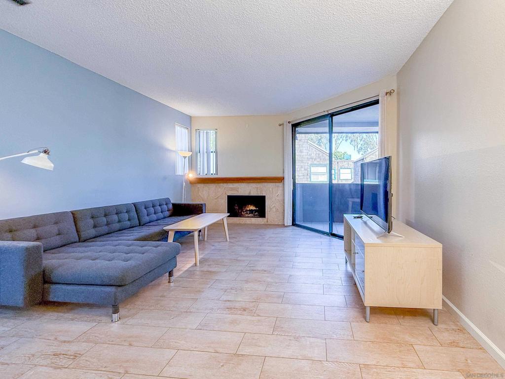 Welcome to 4435 Nobel Drive, Unit 19. This single-level, one-bedroom, one-bathroom condo in a gated community boasts an unbeatable location directly across from Westfield UTC, with quick access to UCSD, dining, and La Jolla beaches just minutes away. This bright corner unit features windows on two sides and was upgraded including paint, flooring, and an updated kitchen and bathroom with granite countertops and cabinets. You'll enjoy the cozy fireplace, in-unit laundry, and two private patios. The complex offers secure parking, a swimming pool, spa, and is close to a dog park. As a significant community-wide benefit, the entire community has been fitted with a newer roof.