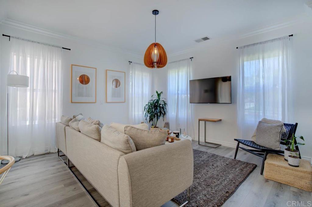 This beautifully remodeled home combines modern elegance with everyday comfort. Situated in a highly sought-after location, it features a spacious open floor plan that seamlessly connects the living, dining, and kitchen areas—perfect for entertaining or relaxing with family. The kitchen is a true showstopper, complete with luxurious marble countertops, sleek cabinetry, and updated appliances. Natural light floods the space, highlighting the thoughtful design and high-end finishes throughout. With its unbeatable location, upgraded interiors, and contemporary layout, this home is move-in ready and waiting for you!