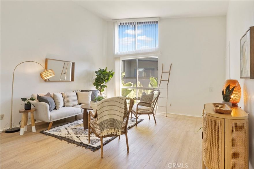 Experience comfort and coastal calm in this beautifully situated one-bedroom, one-bath top-floor condo at Mariner’s Park Village. Located in one of the most desirable and private corners of this gated community, this home offers true serenity with no neighbors above or below. Step inside to a bright and inviting living space with vaulted ceilings that enhance the sense of openness. The living room opens to a private balcony—perfect for morning coffee, reading, or relaxing with the ocean breeze. The balcony is also accessible from the bedroom, creating a seamless indoor-outdoor flow and an ideal retreat at the end of the day.The kitchen is well-designed and functional, offering everything you need within easy reach and plenty of potential for your personal touch. Additional highlights include an assigned carport with outdoor storage, laundry conveniently located just downstairs, and a quiet location shielded from freeway noise.Residents enjoy the well-maintained, park-like grounds of Mariner’s Park Village, featuring two swimming pools, a clubhouse, and a playground. The HOA covers hot and cold water, adding to the home’s exceptional value. If you’re looking for a peaceful, secure home with a coastal feel and quality community amenities, this one is a standout opportunity in Mariner’s Park Village.