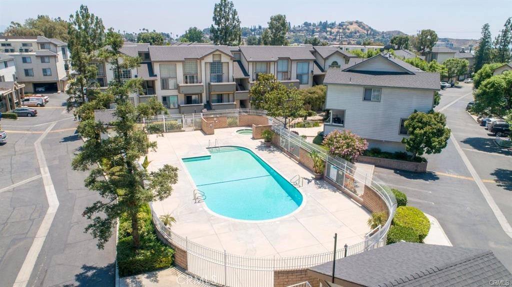 Top floor unit in TURN KEY condition with open floor plan, high ceilings, beautiful big windows featuring new wood-like flooring throughout, recessed lighting, new kitchen with quartz counters, new appliances, new central air & heat, new bathrooms, new fixtures, fresh paint and a decent size balcony off of living room for your enjoyment. This unit comes with 2 tandem parking spaces in a shared garage with another neighbor, washer dryer hook ups are also in garage. The complex offers pool, spa, play ground for residents enjoyments, 24/7 security guard at the front gate. 3rd bedroom is a spacious loft with closet & windows which can be used as bedroom, office or den. Listed below comparable sold units in the complex.