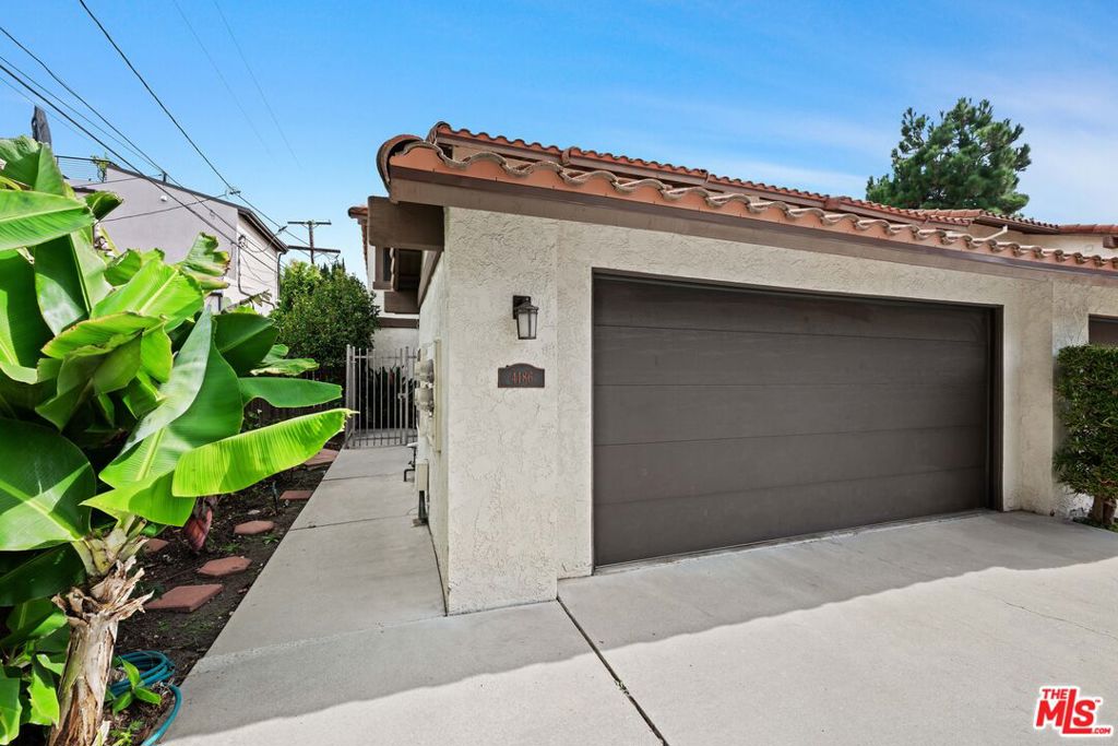 4186 Higuera Street is a rare opportunity to own in one of Culver City's most sought-after neighborhoods, just steps from Platform, Culver Steps, Amazon, Sony Studios, and the Metro Expo Line. This 3-bedroom, 3-bathroom townhome offers 1,246 sq. ft. of living space in a private, gated 13-unit community with a swimming pool and community garden. The first floor features a spacious living and dining area with a cozy gas fireplace and direct access to a large secluded rear yard, perfect for outdoor entertaining. The kitchen offers tile countertops, warm oak cabinetry, and includes appliances: refrigerator, gas range/stove, dishwasher, and microwave. A convenient powder room completes the main level. Upstairs you'll find three bedrooms, including a large primary suite with ample closet space and private bathroom. Two guest bedrooms share a full hallway bath, with generous storage in both the hallway and bedrooms. Enjoy a 2-car attached garage with direct covered front yard access. An additional Assigned parking space (not deeded)! This intimate gated community offers a sparkling HOA pool, a private garden area for growing vegetables, and is in short proximity to Culver City's award-winning public schools, the Hayden Tract, Ivy Station, and vibrant Downtown Culver City. Easy access to the I-405 and I-10 freeways makes commuting to Downtown Los Angeles a breeze. Sold "AS IS", this property is a blank canvas ready for your personal updates and remodeling vision. A fantastic opportunity to create your dream home in a prime Culver City location! Offers Due Thursday September 18th @ 5:00 pm.
