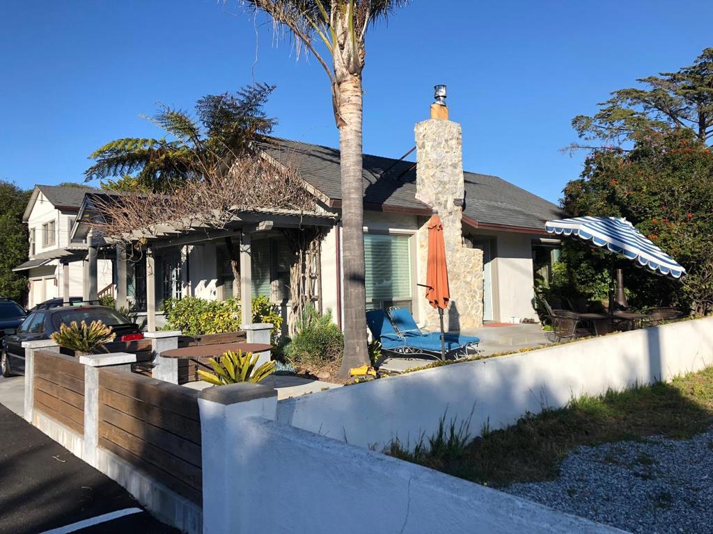 Surfer's Delight! Single-level 2 bedroom 2 bath plus large, detached 2 car garage with unit above. One house in from East Cliff just across the street from iconic surf break.