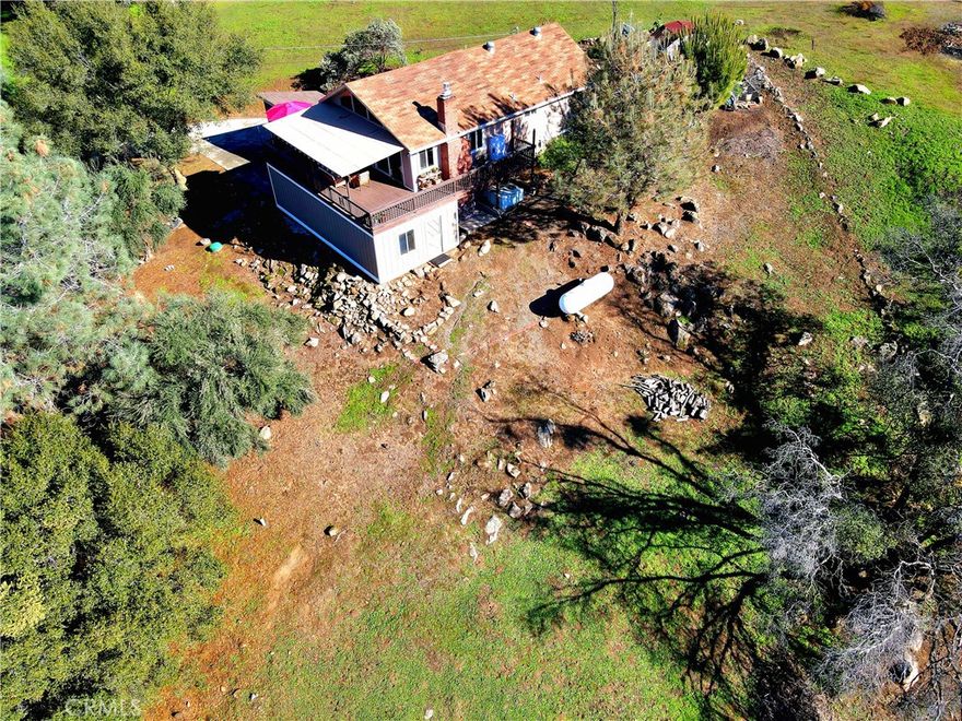 Discover charm and comfort in this beautifully updated 2-bedroom, 1-bath, cabin style home in Yosemite Lakes Park. Set on a well-manicured 1.02 acres, this property offers peaceful living with modern style. Inside, the fully remodeled kitchen and bath shine with fresh finishes, while the bedrooms have been tastefully updated. A versatile bonus room downstairs complete with laundry can serve as an office, studio, or anything you imagine.
Step out to the wraparound deck (covering about 50% of the perimeter) and enjoy breathtaking views of the rolling foothills. Outside, you'll find a fenced garden, low-maintenance landscaping, a 1-car detached garage, plus a 1-car enclosed carport with a gate for extra security.
Yosemite Lakes Park residents enjoy fantastic amenities, including a golf course, swimming pool and hot tub, tennis courts, clubhouse, restaurants, equestrian center, and scenic walking trails. With too many upgrades to list, this home blends modern updates with serene country living just a short drive from Yosemite National Park and Fresno.