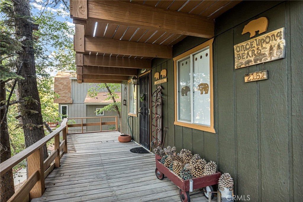 Welcome to your mountain retreat in the heart of Arrowbear! This delightful 2-bedroom, 1-bath cabin blends rustic charm with shabby chic flair, creating a cozy and inviting escape just minutes from Arrowbear Lake and the local park. The house sits on 2 lots which total 4775 sq ft. Step inside to discover a warm, wood-accented interior filled with character—from the quaint "Titan cabin" layout to the lovingly decorated bear-themed touches found throughout the home. The shabby chic kitchen adds a splash of personality and comfort, perfect for enjoying mornings in the mountains. Relax on the spacious front deck off the main floor, ideal for sipping coffee or soaking up the fresh alpine air. The property also offers off-street parking and a private driveway for added convenience. Whether you're looking for a weekend getaway or a full-time mountain haven, this charming Arrowbear cabin offers the perfect mix of comfort, character, and location.