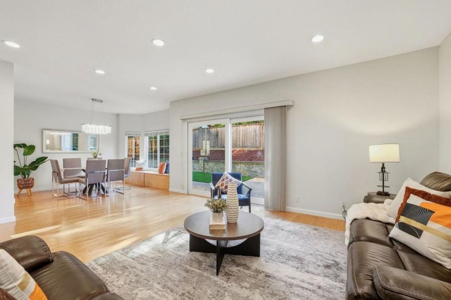 This well maintained 3-bedroom, 3-bath Almaden home offers 2,372 sq ft in a quiet, family-friendly neighborhood served by top-rated Williams Elementary, Bret Harte Middle & Leland High. The kitchen features granite countertops & backsplash, stainless steel appliances, a tray ceiling, recessed lighting & a greenhouse window. A breakfast nook with a built-in bench opens to the yard, while the dining area flows into the spacious living room with sliding glass doors to the backyard. A bonus bedroom or office on the main level with a fireplace is conveniently located near a full bath, ideal for guests or multigenerational living. The primary suite has double doors, tray ceiling, ceiling fan, recessed lighting & hillside views. The ensuite bath offers dual sinks, while two additional bedrooms share a hall bath with double sinks & a shower over tub. The upstairs landing includes a skylight & built-in cabinetry. Updates include bamboo flooring, owned solar panels, EV charger, water softener, newer windows, patio doors & exterior paint. The two-tiered backyard with new turf is ready for play, entertaining or relaxing. Enjoy a residents-only community pool & proximity to Cathedral Park, Glenview Park, Almaden Country Club, Calero Reservoir, hiking trails & Almaden Expressway.