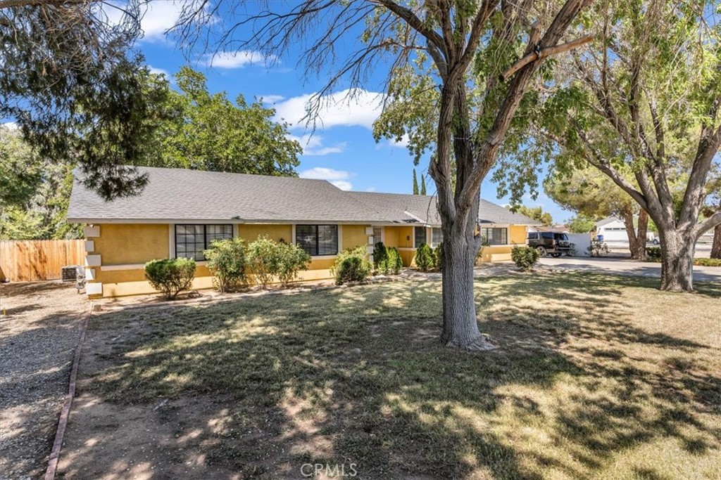Welcome to this inviting 3-bedroom, 2-bath home that is situated on a fully fenced lot, offering both security and privacy. The spacious front and back yards include mature trees—ideal for outdoor enjoyment. A large covered patio in the backyard provides a perfect space for relaxing or entertaining year-round. Step inside to find a warm and inviting interior featuring an open-concept family room with natural light and a cozy fireplace. The kitchen offers ample counter space and cabinetry, ideal for both everyday cooking and hosting. Located in a peaceful, established neighborhood, you're just minutes from local shopping centers, schools, dining, and parks—everything you need is conveniently close.