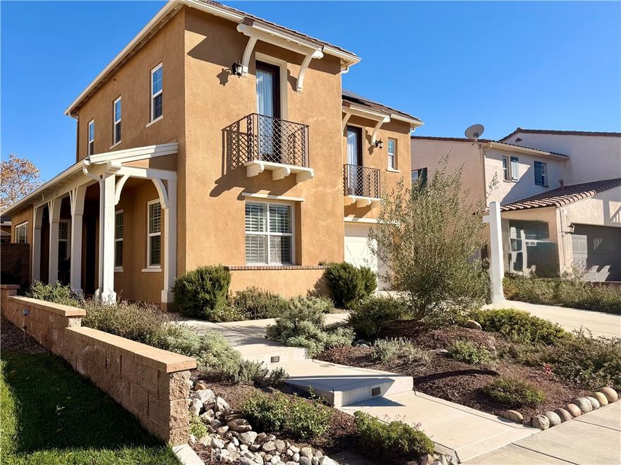 Set along the gently curving streets of Wolf Creek, this four-bedroom, three-bath residence rises with quiet authority. Balanced in form and deliberate in design, it offers a full bedroom and bathroom on the main level, seamlessly integrated into the home’s natural flow. Owned solar further supports the home’s thoughtful efficiency, fully paid and already in place.

At the center, the kitchen opens around its island, where preparation and pause exist in equal measure. Nearby, the family room is anchored by a gas-and-wood fireplace, a steady hearth lending warmth and presence throughout the seasons.

Beyond, the backyard unfolds in abundance, planted with lemon and orange trees, white and yellow peaches, and two varieties of grapevine, all rooted and thriving beneath open sky. A deep, covered patio shelters the full outdoor living area, while a private side yard with gazebo—accessed from the breakfast nook—offers a quiet retreat set apart.

Above, the home opens further. A large loft forms the heart of the upper level, joined by an upstairs laundry room with utility sink and generous storage. Three Juliet balconies invite light and air inward, softening the transition between interior and sky. The primary bedroom suite is expansive, featuring an adjoining area ideal for a sitting or relaxation space, creating a private and composed retreat.

Below, the two-car garage includes one oversized bay, providing uncommon depth for storage, projects, or extended-length vehicles.

Wolf Creek’s HOA amenities include a clubhouse, fitness center, pool, children’s pool, hot tub, outdoor showers, a fenced lawn with three covered gazebos and BBQ grills, and a covered event terrace with fireplace and seating. Seasonal community gatherings mark the year throughout.

A home shaped by intention, grounded in land, and set within a well-established community—enduring, composed, and complete.

Here, space is given room to breathe. Light moves easily through the home, carried upward to open halls and outward through measured lines. From shaded patio to quiet garden corners, from lofted interiors to cultivated ground, each element feels placed with care rather than chance. Scale and proportion are carefully held throughout, creating rooms that feel open yet grounded. This is a setting shaped not for haste, but for continuity—where structure, landscape, and community settle into a lasting and well-ordered whole.