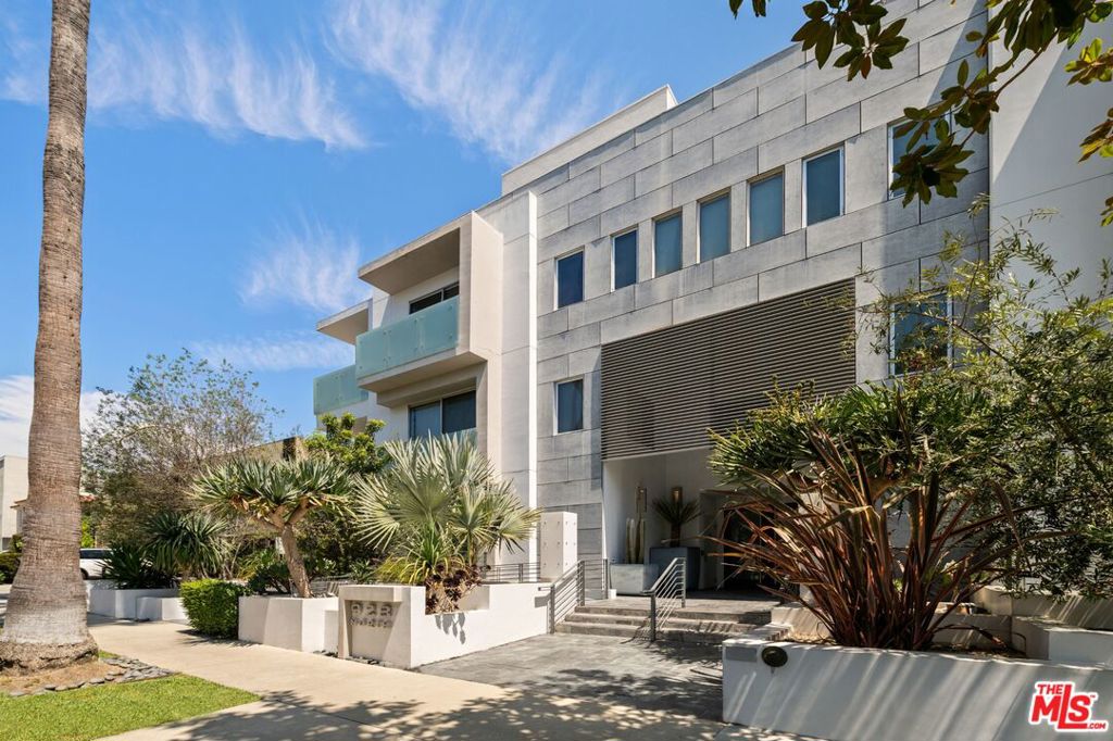 Stunning front-facing corner penthouse at the exclusive Luminaire in West Hollywood. This approx. 2,053SF, 2BD, 3BA light-filled unit features soaring ceilings, expansive windows, and a private balcony for seamless indoor-outdoor living. Walnut floors and custom designer shelving elevate the open floor plan, while the gourmet kitchen boasts Italian Bontempi cabinetry, Caesarstone counters, Bisazza tile, a Smeg 5-burner range, Bosch ovens, paneled refrigerator, and breakfast bar. The primary suite offers a walk-in closet and spa-like bath with Blu Bathworks sinks and Zuma soaking tub. Additional features include a guest suite, powder room, in-unit laundry, and two parking spaces with six guest spots in a controlled-access garage. Residents enjoy video intercom entry and a rooftop deck with sweeping 360-degree views of the city and Hollywood Hills. Modern comfort and design in the heart of West Hollywood, just moments from the best of West Hollywood's dining, shopping, and nightlife.