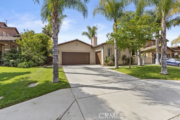 Turnkey Beauty!!!!!!! Spanish style single story home located in Perris coveted Monument Valley. This home has been lovingly cared for by the owner and features a modern open concept floor plan with kitchen/great-room, formal dining room, a super-private front courtyard and 4 spacious bedrooms. The kitchen is finished in white cabinets topped with white tile counters, giant island/bar with 3 lovely pendant lights and built in oven. Just off the kitchen and providing access to the garage is a spacious laundry room with loads of storage and a built-in sink. Flooring is wood like planks tiles. You'll love the entry which has a gated front courtyard leading into a very private, and larger, enclosed courtyard with fireplace. The large master bedroom and attached en suite bathroom is your own private retreat and features a peninsula tub and dual vanities. Bedrooms 3 & 4 share a jack-n-jill bathroom and bedroom #2 makes a perfect hobby room, office or...bedroom. Enjoy the view of your fully landscaped backyard from the comfort of a very nice California Room which is ideal for spending time outdoors but not in the direct sunlight. To top it all off you have 3 garage spaces to fill with all your stuff making this the ideal home for you. Hurry, it won't last!