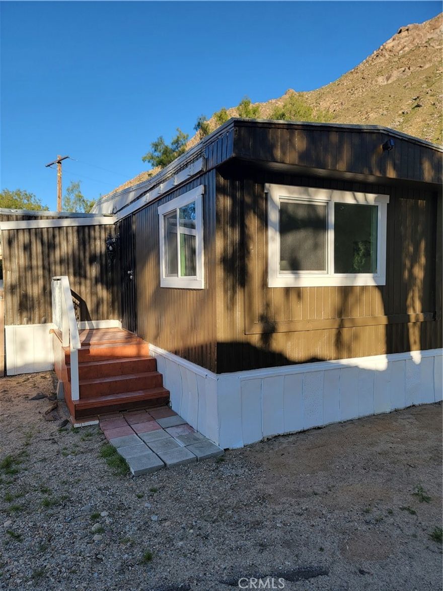 Beautiful 1973 Skyline/Singlewide manufactured home centrally located in beautiful North-End Palm Springs family park, just 10-15 mins from 10 Fwy exchange & Morongo Casino, minutes to Downtown Palm Springs/Aerial Tram and Cabazon Premium Outlets. Remodeled, painted inside and out, new windows/flooring, 2nd bedroom has extra room for either laundry room or build second full bathroom. Nice patio/BBQ area, new entry decks on both sides of the house, large secured/fenced in yard for your privacy (room for additions), big shed for storage, Carport for two vehicles and additional space on side front for more parking, low monthly space rent $625, Buyer(s) must qualify through park management first. Selling "AS IS, SELLER WILL NOT MAKE ANY REPAIRS".