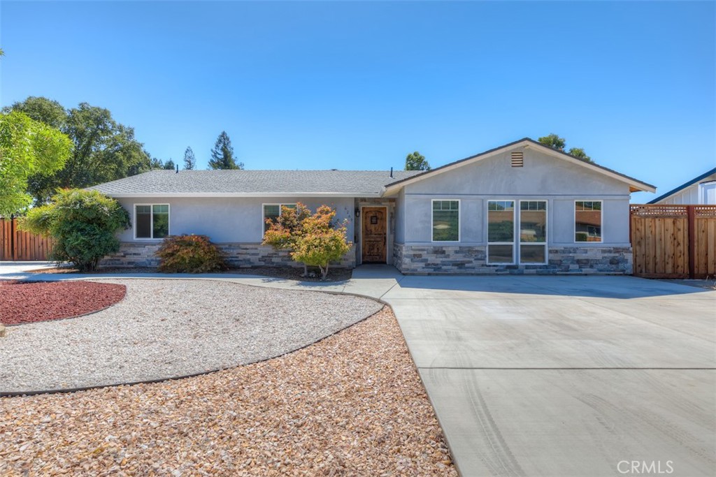 This home takes REMODEL to a whole different level!!! Welcome to this stunning, completely remodeled 3BD, 2BA home nestled on a spacious .54-acre lot. Built in 1973, this charming residence boasts 1,617 square feet of beautifully updated living space. Step inside to discover a modern and inviting interior featuring a seamless blend of style and comfort. The open-concept layout is perfect for both relaxing and entertaining, with a bright and airy atmosphere throughout. The heart of the home is the gourmet kitchen, showcasing sleek quartz countertops, stainless steel appliances, and ample cabinet space. The living room is a cozy retreat, ideal for unwinding after a long day. The primary bedroom offers a peaceful sanctuary with a luxurious en-suite bathroom, complete with a walk-in shower and elegant finishes. Two additional bedrooms provide versatility for guests, a home office, or a personal gym. Outside, the expansive yard offers endless possibilities for outdoor enjoyment and relaxation. The property features a convenient 20'x30' shop, perfect for hobbies or storage, as well as a 10'x30' carport for additional parking or covered outdoor space. Located in a desirable neighborhood, this home combines modern amenities with the tranquility of a spacious lot, creating the perfect setting for your next chapter. Don't miss the opportunity to make this beautifully renovated property your own. Schedule a showing today and check out the full amenity sheet in supplements!