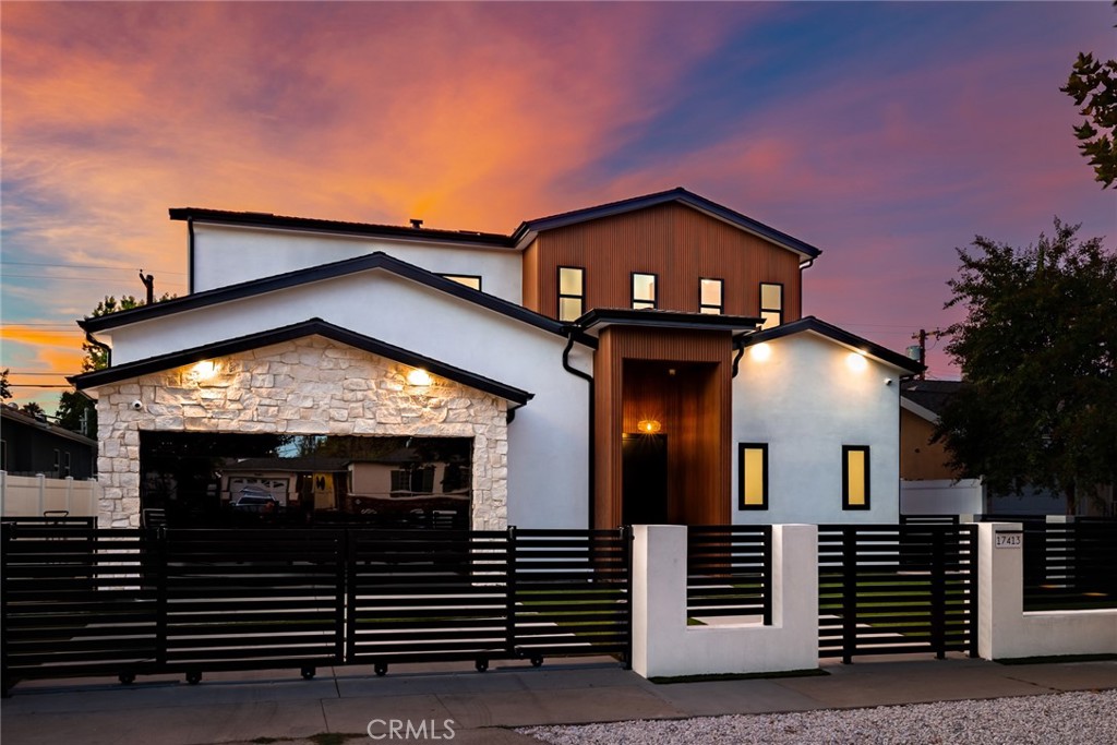 This exceptional, brand-new custom home with a detached ADU offers a sophisticated and versatile living experience in a prime Encino Park location, with the added benefit of being fully pre-wired for seamless smart home functionality. The property is fully gated from the street, featuring a striking frameless glass garage door that sets a modern tone. Inside, the open floor plan is illuminated by natural light pouring through expansive floor-to-ceiling multi-slide glass doors, highlighting the wide plank oak hardwood floors and high ceilings. The heart of the home is a chef's dream kitchen, seamlessly flowing into the family room, complete with a massive quartzite-covered island, bespoke white oak cabinetry, and a suite of top-tier Thermador and Miele appliances. The main level is completed by a convenient bedroom, a full bath, and a stylish powder room. Upstairs, three additional bedrooms each feature an en-suite bathroom, including the luxurious primary suite, which offers direct access to a large balcony spanning the back of the home. Throughout the residence, a network of pre-installed speakers, cameras, and data wiring provides the foundation for integrated smart technology. This thoughtful preparation ensures that the home is readily wired for additional entertainment and automation, delivering a modern, connected lifestyle from day one. For ultimate flexibility, a separate, fully functioning ADU provides just under 550 square feet of high-end living space, including a full kitchen and laundry closet, all finished with the same premium materials as the main residence. Situated in a coveted area, this home provides easy access to excellent shopping and dining, plus super-easy freeway access for a perfect blend of luxury and convenience. Seller has "Ready to issue" plans for a pool which can be included in the purchase just in case you are hoping for a home with a pool.