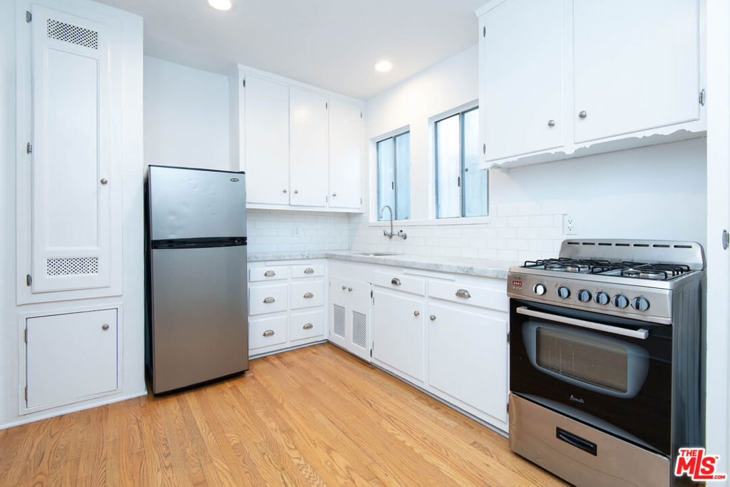 Beautiful and fully updated studio apartment in charming 1930s building, with amazing landscaped center courtyard. All the character and style of the original architecture, with new renovations. Includes private outdoor patio. New kitchen including marble countertops and stainless appliances. New bathroom with marble flooring and updated fixtures. White oak hardwood floors throughout. Air conditioning, and laundry just outside your front door. Amazing location in West Hollywood "West" and just a short walk to Ralph's, Bristol Farms, and the best of Melrose Ave, including Verve Coffee, Great White, Craig's, and the best shopping in West Hollywood. Secured access building. Street parking by permit only. This will go quickly - please email or text for showings.